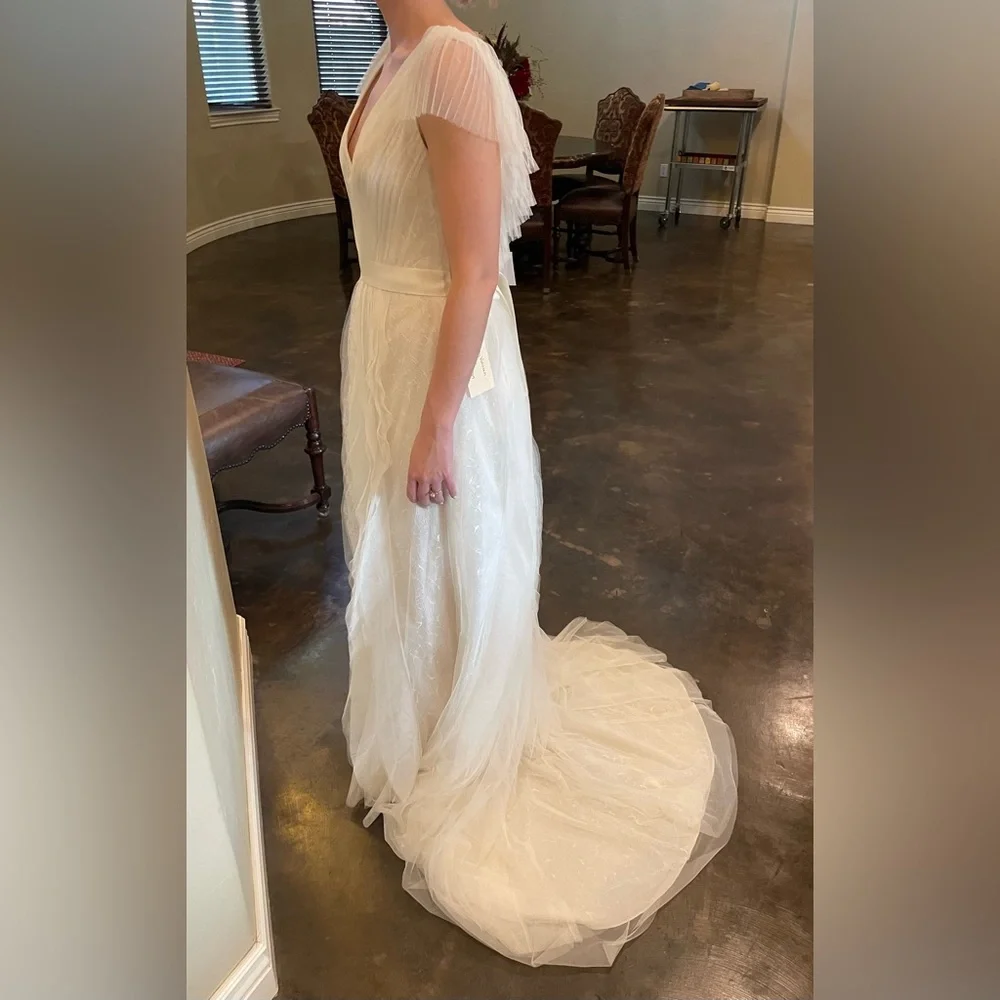 Beautiful Vera Wang wedding dress from David’s Bridal. Model is a size 0-2. - Picture 4 of 6